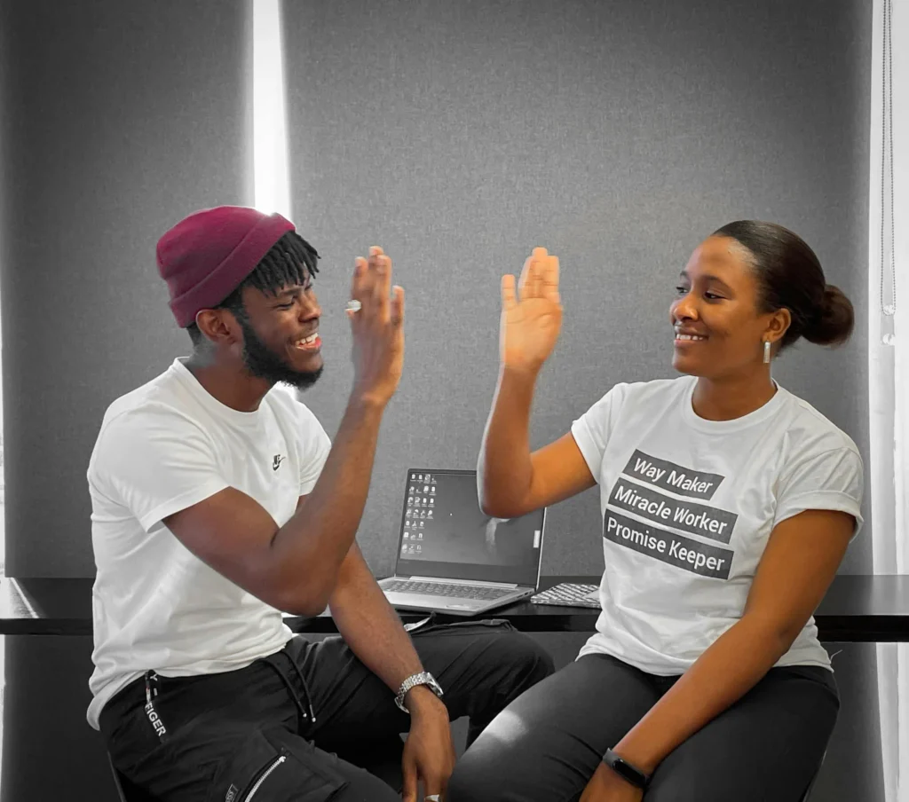 Man and woman giving high-five 